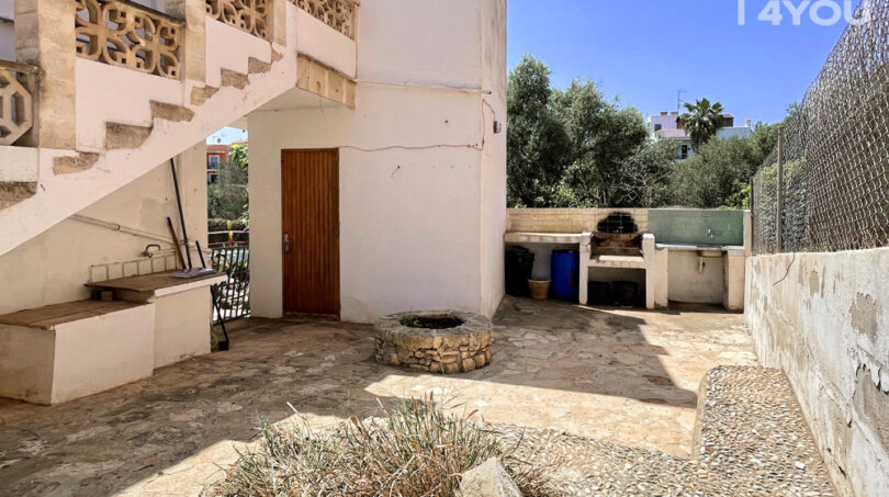 Terraza con cocina exterior
