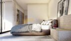 Modernes Schlafzimmer der Neubauvilla in Calvià mit elegantem Doppelbett und Holzelementen