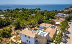 Aerial view of new-build villa Sol de Mallorca with pool, solar roof, Mediterranean garden and sea view