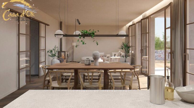 Modernes Esszimmer mit Holztisch, Designer-Stühlen und Kamin im Neubau-Landhaus bei Porto Cristo