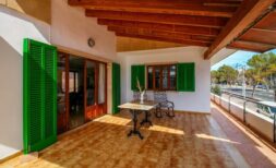 Covered terrace with green shutters, wooden ceiling and bistro table, close to beach in Alcudia