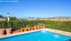 Private pool with terracotta pots and panoramic views of Port Adriano and the Mediterranean Sea