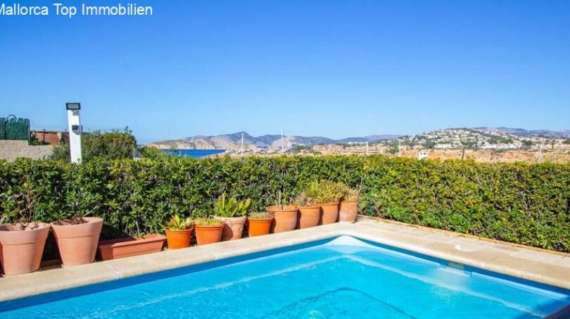 Private pool with terracotta pots and panoramic views of Port Adriano and the Mediterranean Sea