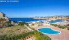 Chalet in Calvia with heart-shaped pool, panoramic views of Port Adriano harbor and the blue Mediterranean Sea.
