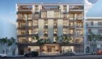 Modern apartment building in Palma de Mallorca with balconies, rooftop terrace and elegant entrance area.