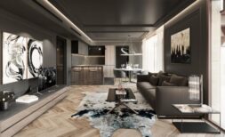 Elegantes Wohnzimmer mit Ledersofa, Küchenzeile und Chevron-Parkettboden in luxuriöser Apartment in Palma de Mallorca.