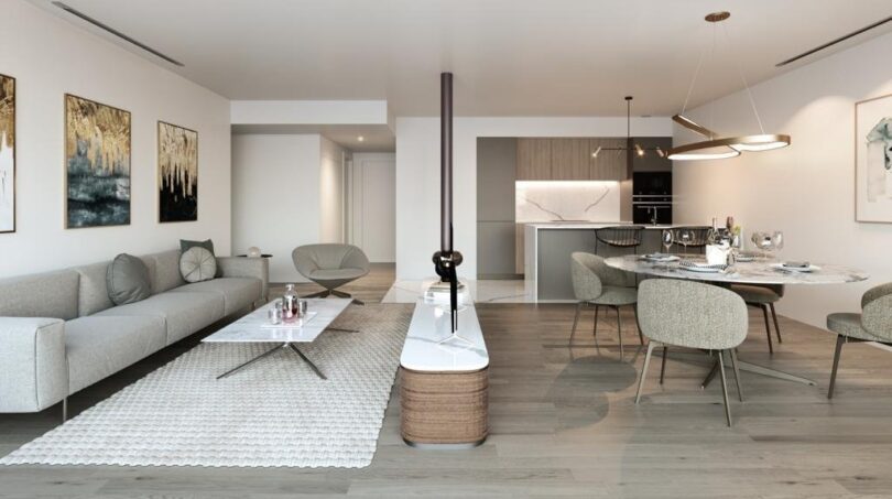 Modernes Wohnzimmer mit offener Küche, Esstisch und elegantem Kamin in luxuriösem Apartment in Palma.