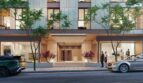 Elegante Außenfassade eines Luxusapartments in Palma de Mallorca mit beleuchtetem Eingang und Bäumen.