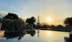 Piscina infinita con puesta de sol y palmeras, Villa Santa Ponça