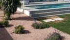 Moderne Luxusvilla in Cala Pi mit Pool, Gravel-Garten, Glasbalkon und mediterraner Bepflanzung.