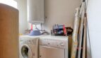 Utility room with washing machine, dryer and hot water heater in the property in Santa Ponça.