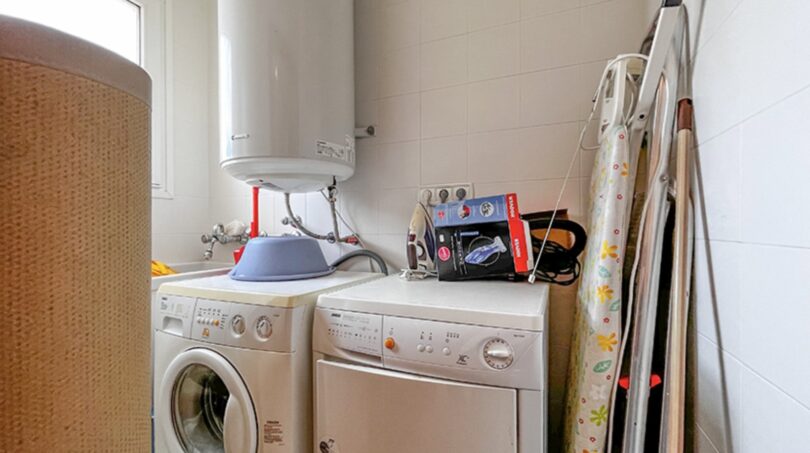 Utility room with washing machine, dryer and hot water heater in the property in Santa Ponça.