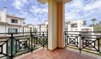 Spacious balcony with wrought iron railing and view of Mediterranean residential complex in Santa Ponça