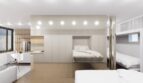 Modernes Loft-Schlafzimmer mit Stockbett, Einbauschrank und offenem Wohnbereich in Palma de Mallorca