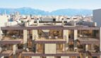 Modernes Wohngebäude in Palma mit Balkonen, Dachterrasse und Bergpanorama im Hintergrund.