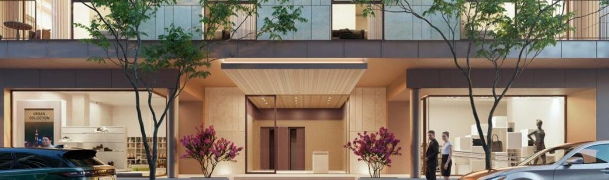 Modern luxury apartment building in Palma with elegant entrance, flowering plants and underground garage access.