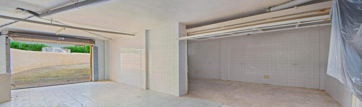 Image of the property: 38m² underground parking garage with access road and storage area for sale