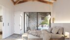 Helles Schlafzimmer mit Holzbalkendecke, Natursteinboden und Terrassenzugang in exklusiver Neubau-Finca, Artà