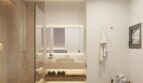 Modernes Badezimmer der Neubau-Finca in Artà mit Regendusche, Naturstein und mediterranem Ambiente.