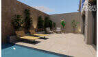 Terraza con piscina, tumbonas, zona de descanso y zonas ajardinadas en el proyecto de construcción de S'Alqueria Blanca