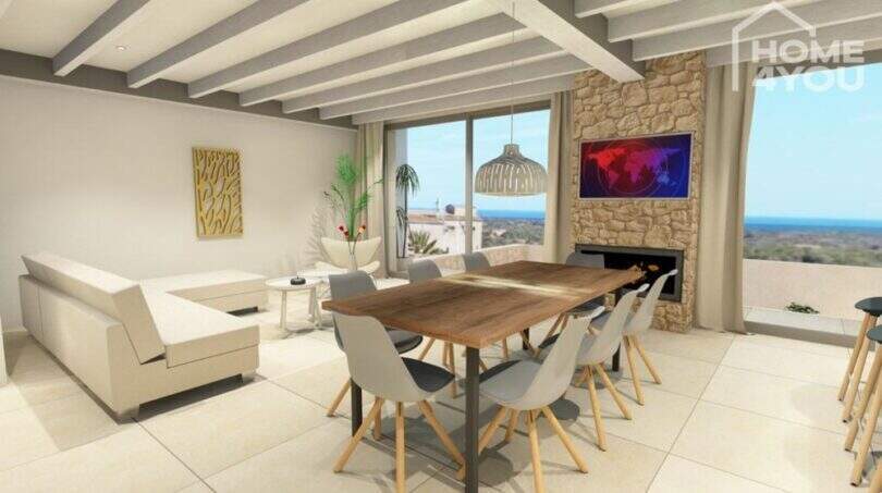 Helles Wohn-Esszimmer mit Holzbalkendecke, Steinwand, Kamin und Meerblick in Villa S'Alqueria Blanca