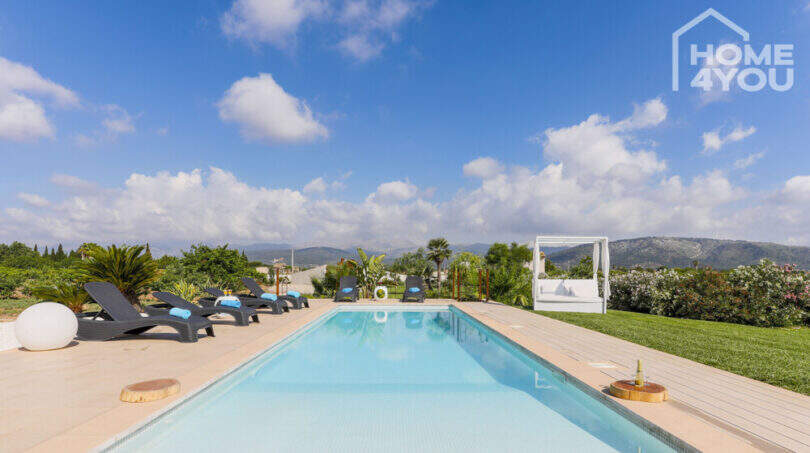 Panorama pool with loungers and canopy bed, Mediterranean garden with mountain view, finca Sa Pobla