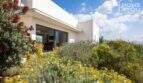 Mediterranean finca Sa Pobla: exterior view with wildflower garden, lavender and large terrace sliding door