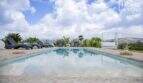 Panorama pool with sun loungers, canopy lounge and mountain view of the Mediterranean finca in Sa Pobla