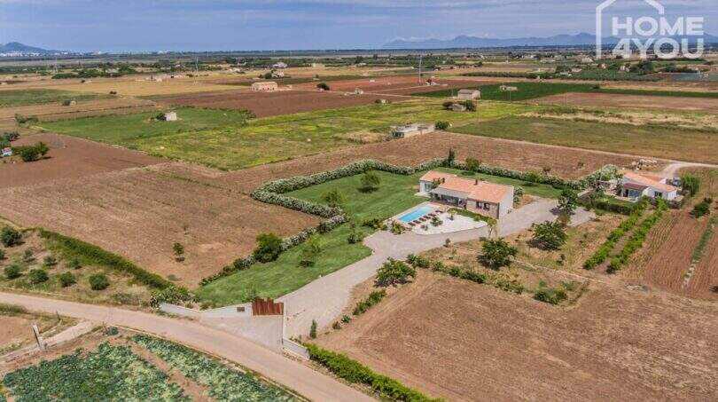 Aerial view of the Mediterranean finca in Sa Pobla with pool, green spaces and separate guest house on 24,000 m²