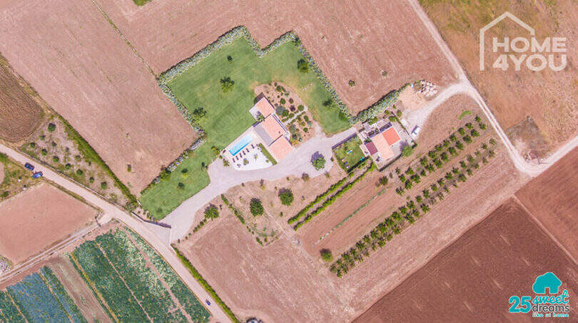 Aerial view Mediterranean finca Sa Pobla: main house, guest house, pool, green space, 24,000 m² property
