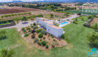 Aerial view Mediterranean finca Sa Pobla: modern country house with pool, expansive garden & mountain views