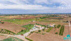 Aerial view Mediterranean finca Sa Pobla: main house with pool, guest house, garden, 24,000 m² property, mountain panorama