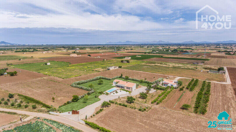 Aerial view Mediterranean finca Sa Pobla: main house with pool, guest house, garden, 24,000 m² property, mountain panorama