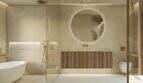 Moderno cuarto de baño de lujo de la finca de Artà, con bañera independiente, espejos redondos y grifería dorada.