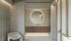 El elegante cuarto de baño de la Finca Artà, con un espejo redondo, un lavabo de madera y un ambiente acogedor