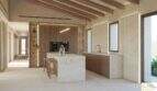 Cocina moderna de la Finca Artà con isla de mármol, techo con vigas de madera y paredes de piedra natural de estilo mediterráneo