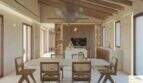 Salón-comedor diáfano con techo de vigas de madera, suelos de imitación de mármol y una cocina moderna en esta exclusiva finca de Artà
