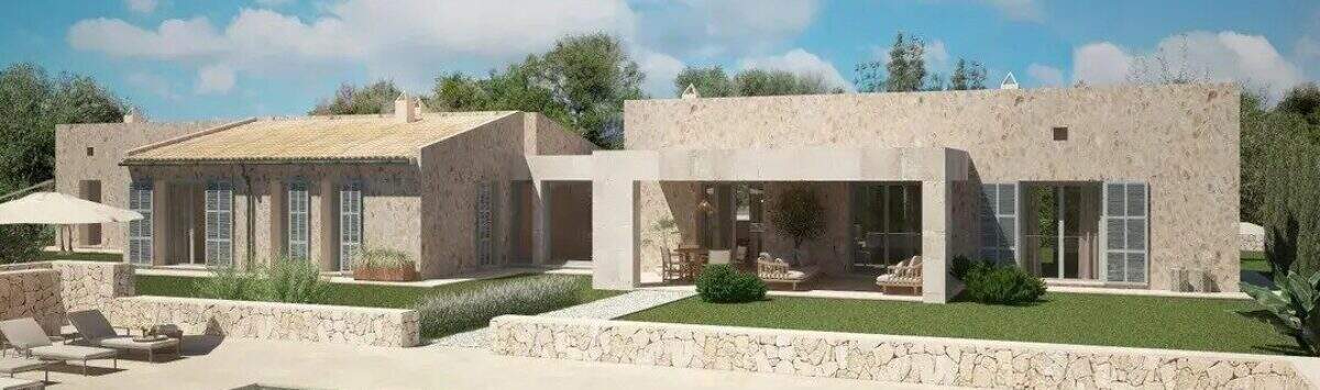 Vista exterior de una finca exclusiva en Artà con piscina, muros de piedra natural y encanto mediterráneo