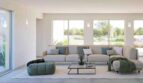 Helles Wohnzimmer der Finca Cala Murada mit Panoramafenstern, modernem Sofa und Gartenblick