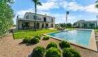 Finca Portocolom: Mediterraner Pool mit gepflegtem Garten, Palmen und Natursteinvilla in traumhafter Lage