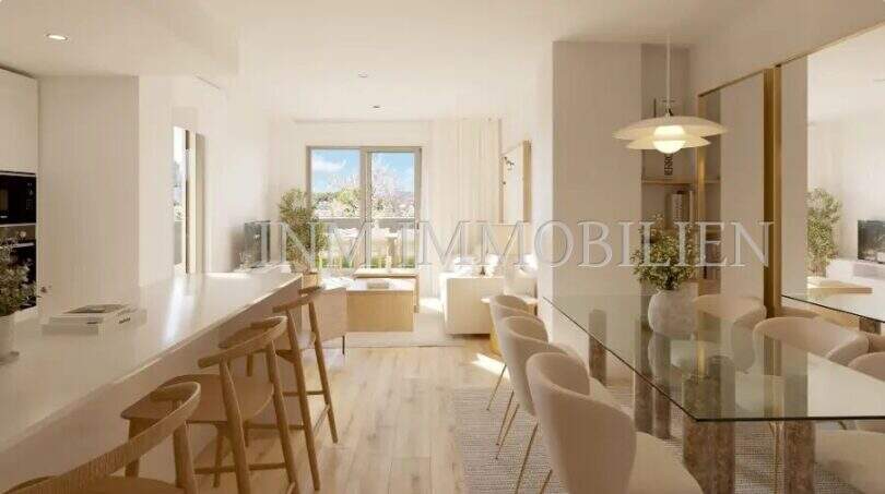 Bright living-dining area with kitchen island, glass dining table and sea view window in new apartment Palmanova