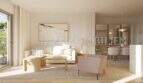Bright living room of a new apartment in Palmanova with modern design, wooden floor and large glass front to the balcony.