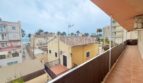 Balcony with sea view, palm trees and Mediterranean surroundings of an apartment at Playa de Palma, Mallorca.