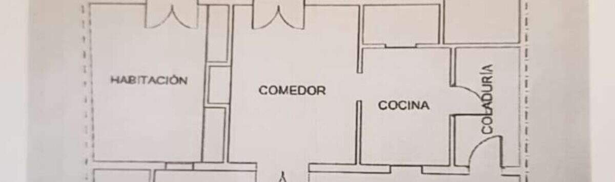 Floor plan of the original layout: 3 bedrooms, living area, kitchen, 2 bathrooms, patio, and storage room
