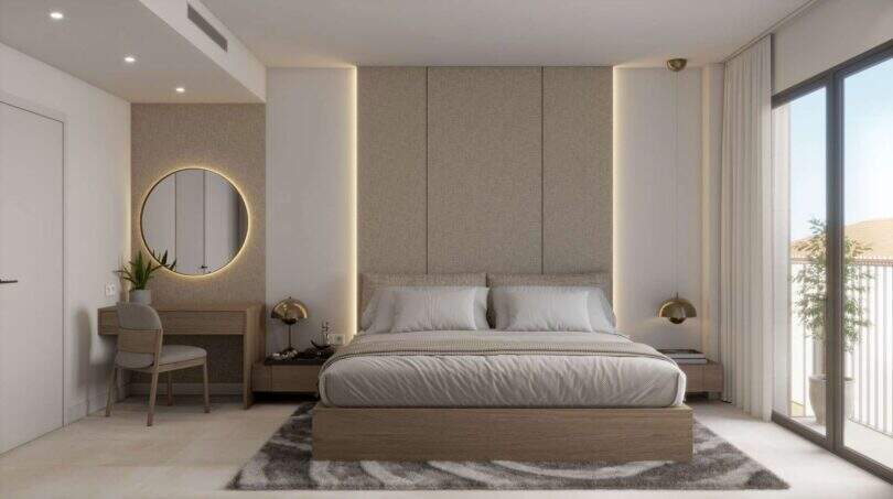 Modern bedroom with double bed, LED wall panel, balcony and elegant furnishings in the new Porto Cristo building