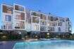 Exterior view of new construction Palmanova: modern residential complex with pool, balconies and wood elements in evening light.