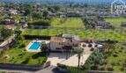 Aerial view of a Majorcan country estate in Lloseta with pool, solar system and spacious garden.