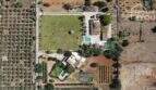 Foto aérea finca mediterránea Santa Margalida: piscina, pista de pádel, zona verde, olivar en 8.970 m²