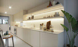 Modern white fitted kitchen with LED lighting, open shelves and high-quality equipment in the Esporles townhouse