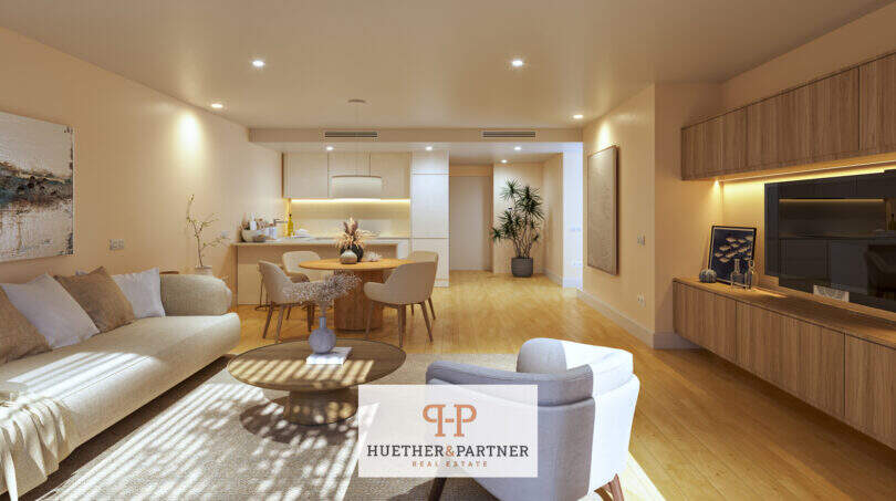 Helles Wohnzimmer mit offenem Grundriss, Eichenparkett und moderner Einbauküche im Neubau Cor 39, Palma
